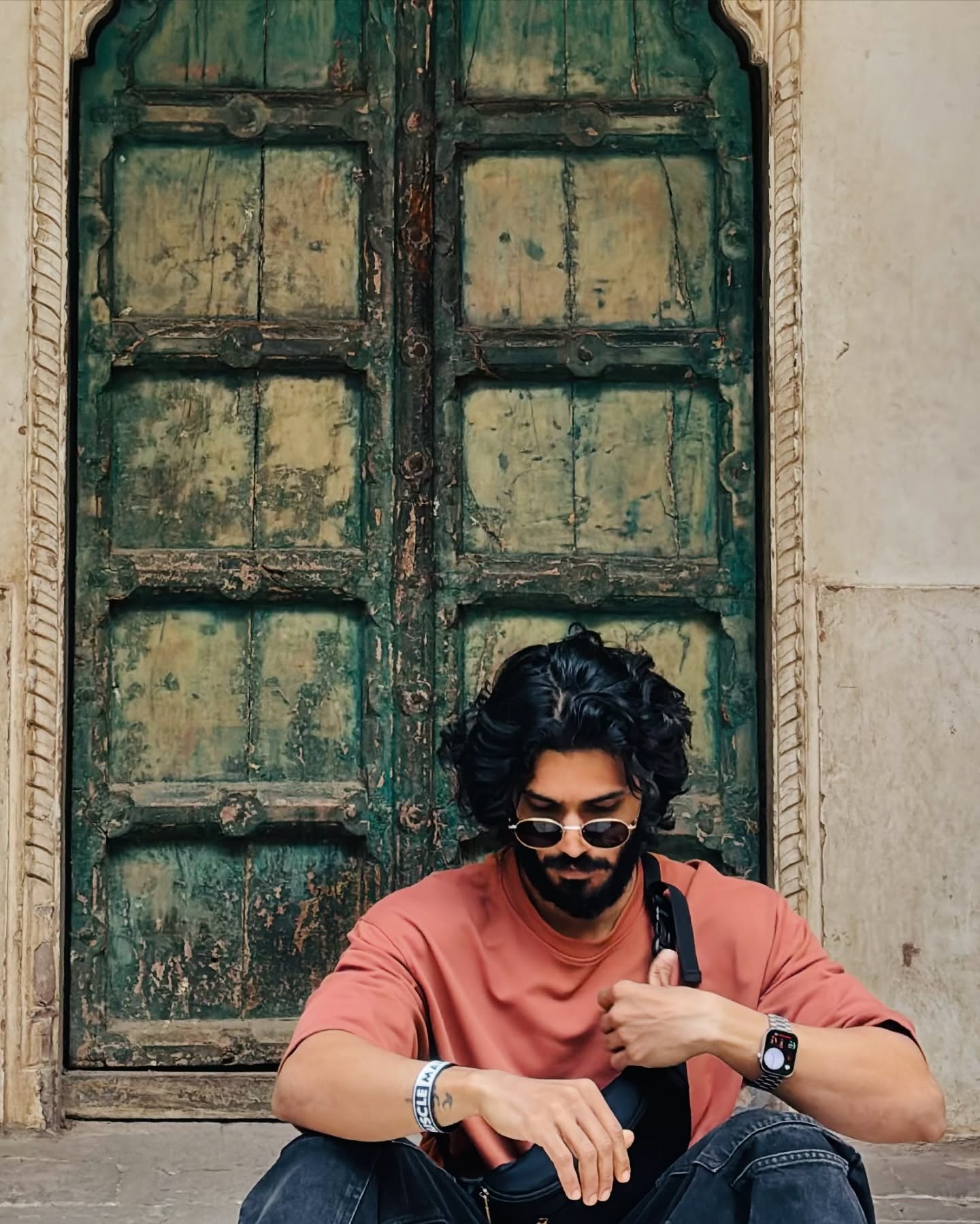 Kedar at a vintage green door